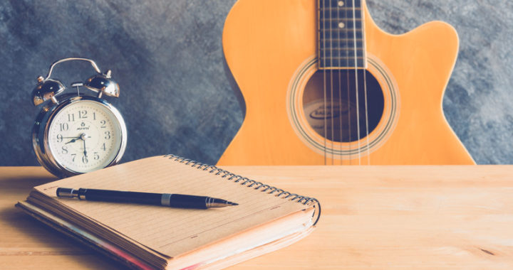 Guitar and Notepad - Songwriting schedule