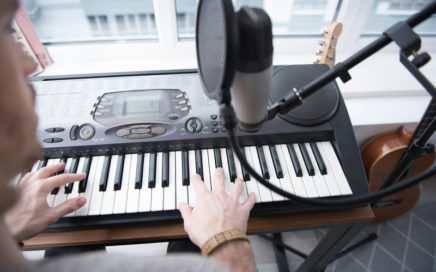 Songwriter working at a keyboard