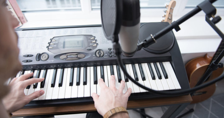 Songwriter working at a keyboard